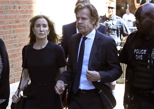 Felicity Huffman arrives at court with her husband William H Macy in Boston 