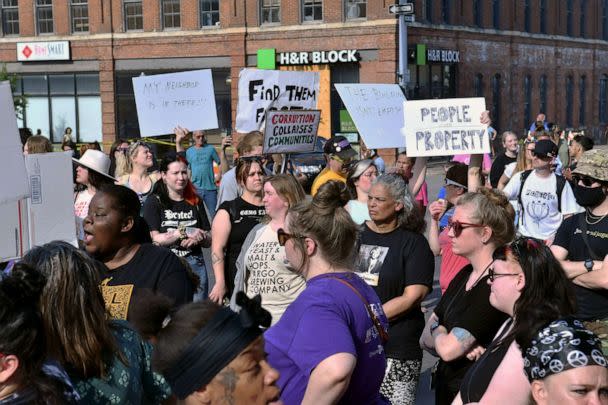 PHOTO: Protesters stand outside of Davenport City hall as rescuers enter the partially collapsed apartment building to remove tenants pets, May 30, 2023, in Davenport, Iowa. (Gary Krambeck/Quad City Times via AP)