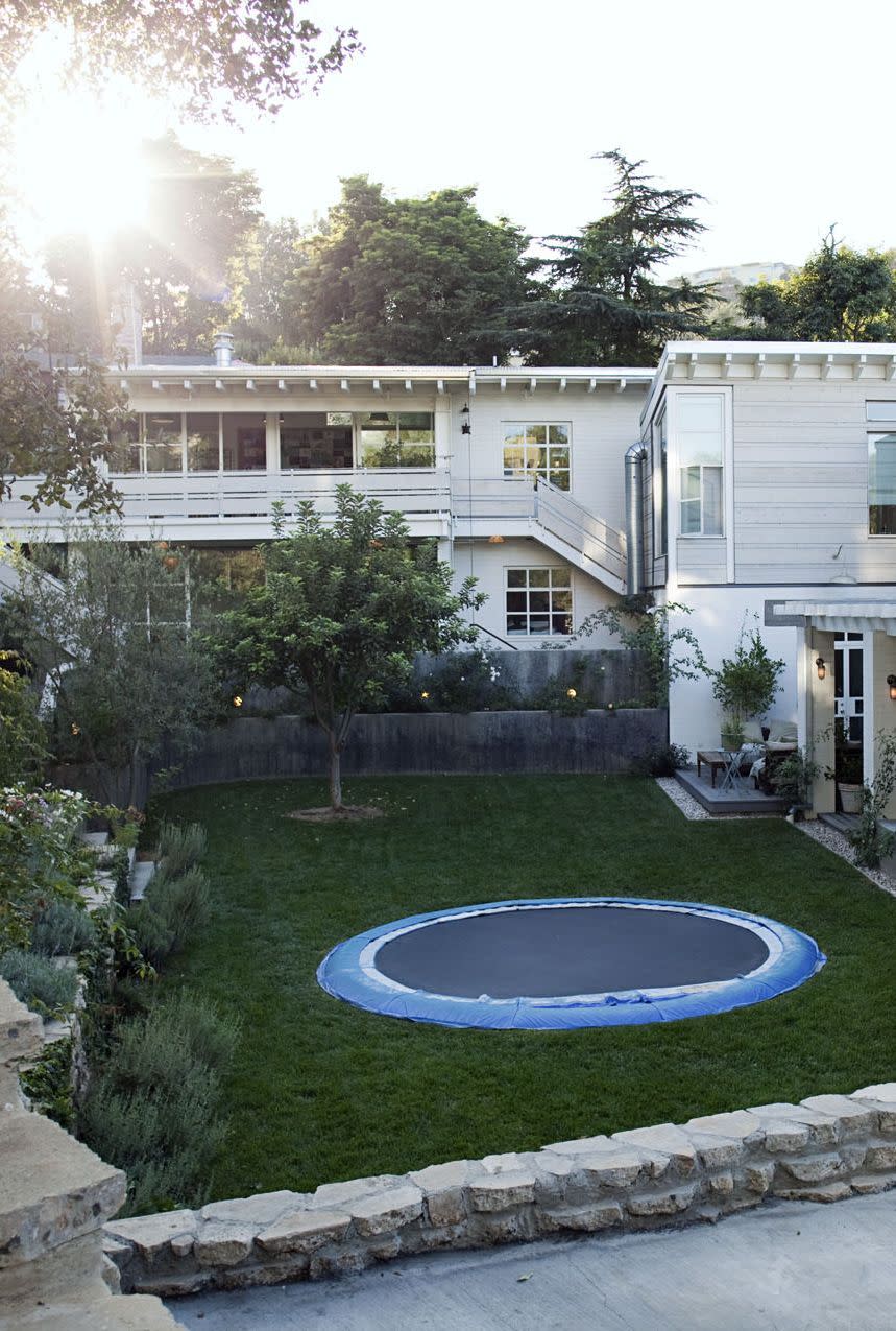 a swimming pool in front of a house