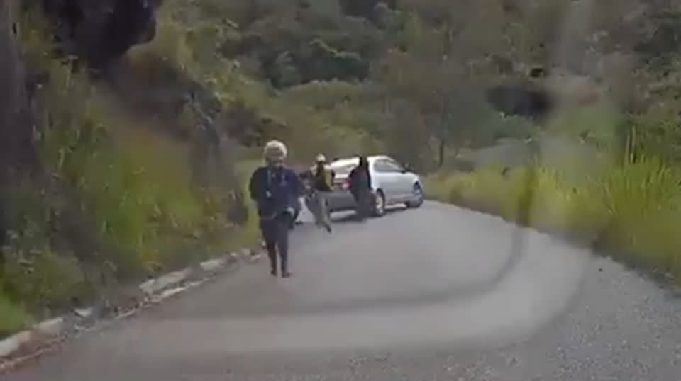 Four heavily armed men emerge from the vehicle and begin sprinting at the Australian family. Source: Facebook