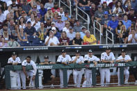 Vanderbilt players watch action against Mississippi State during the fourth inning in Game 3 of the NCAA College World Series baseball finals, Wednesday, June 30, 2021, in Omaha, Neb. (AP Photo/Rebecca S. Gratz)