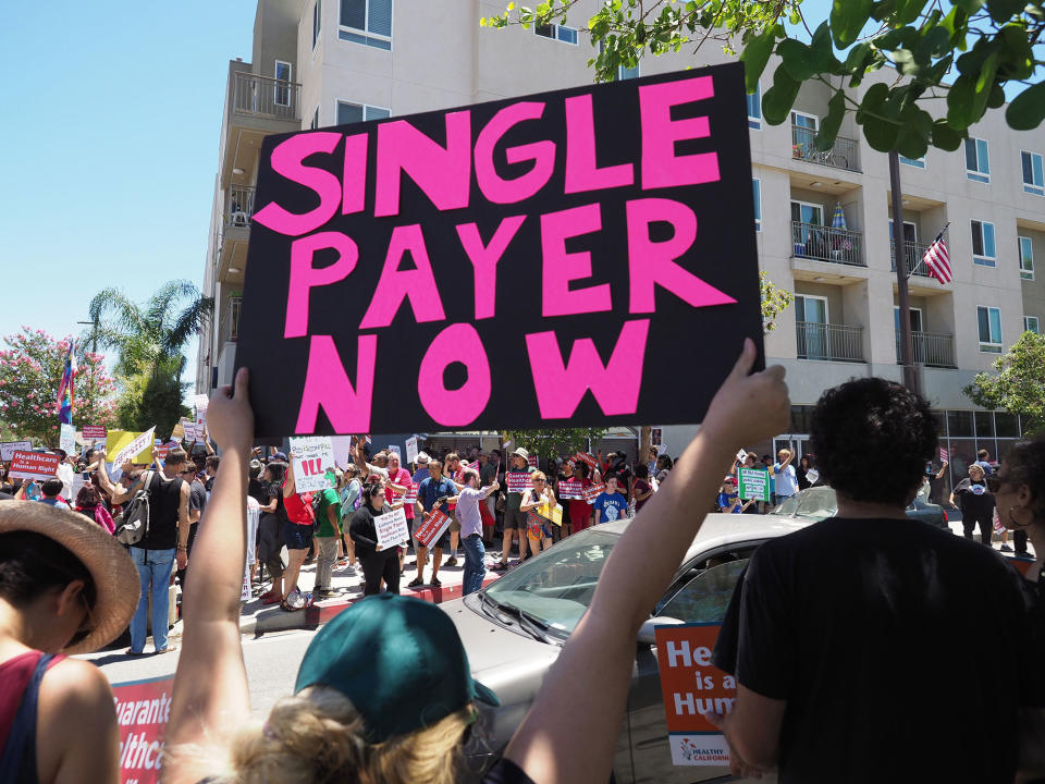 <p>People rally in favor of single-payer healthcare for all Californians as the US Senate prepares to vote on the Senate GOP health care bill, outside the office of California Assembly Speaker Anthony Rendon, June 27, 2017 in South Gate, Calif. (Photo: Robyn Beck/AFP/Getty Images) </p>