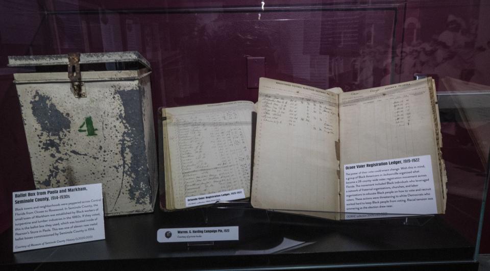 Two voter registration ledgers and a ballot box from the early 19th century are among artifacts on display at the Ocoee Massacre exhibit at the Orange County Regional History Center. The 1920 incident started when a Black man was refused his right to vote.
