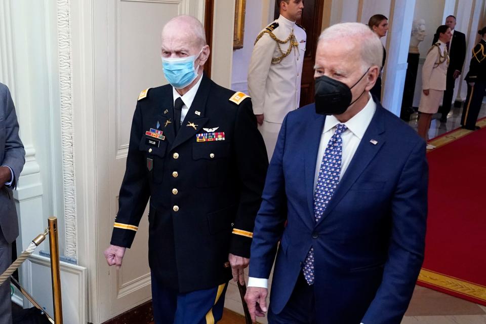 President Joe Biden arrives with Capt. Larry Taylor, an Army pilot from the Vietnam War who risked his life to rescue a reconnaissance team that was about to be overrun by the enemy, to award him the Medal of Honor during a ceremony Tuesday, Sept. 5, 2023, in the East Room of the White House.