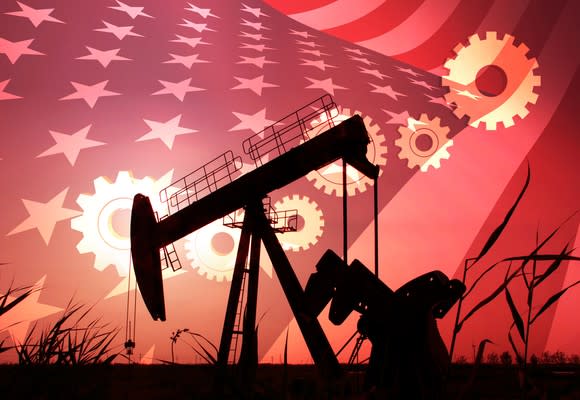 An oil pump with an American flag in the background.