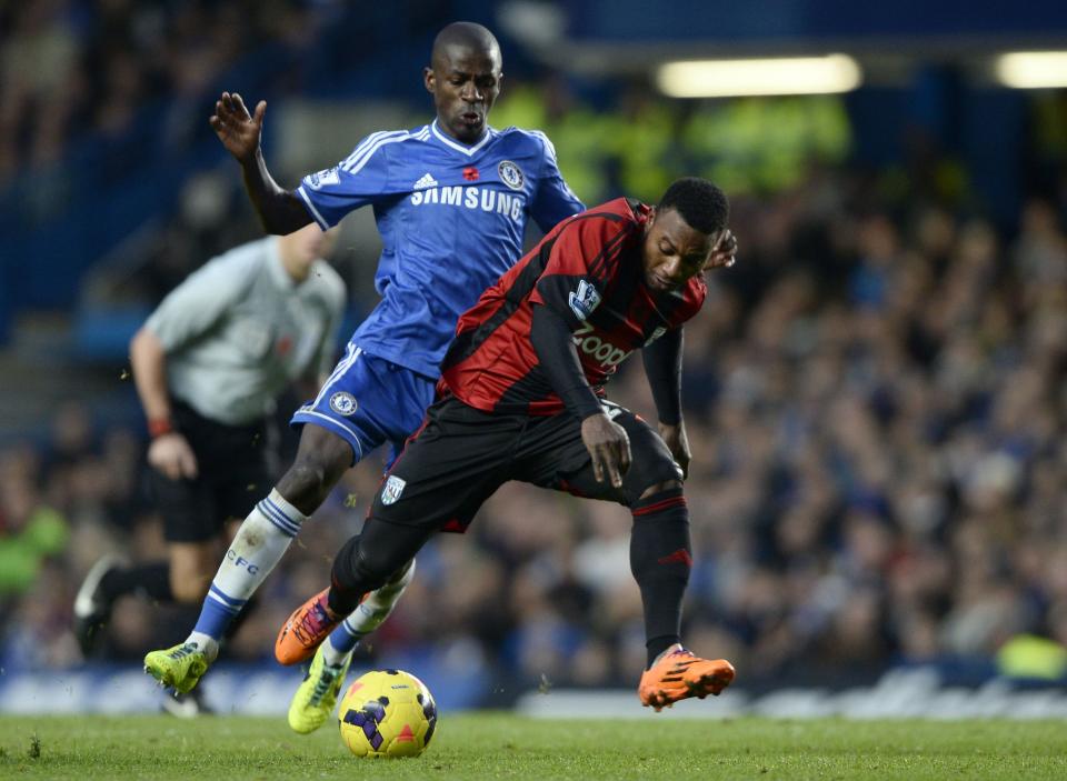 Chelsea's Ramires (L) challenges West Bromwich Albion's Stephane Sessegnon during their English Premier League soccer match at Stamford Bridge in London November 9, 2013.