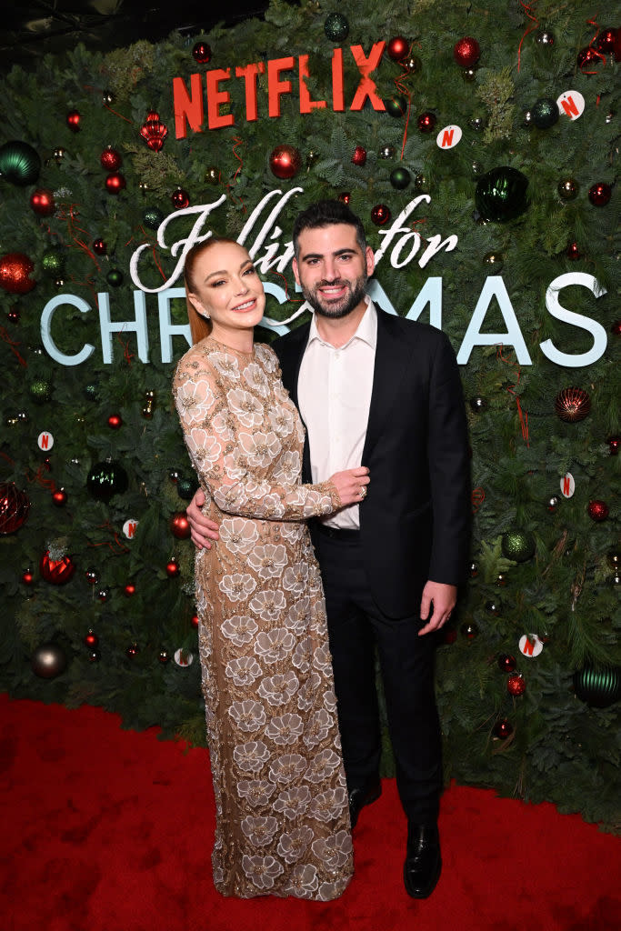 Lindsay and Bader smiling on the red carpet