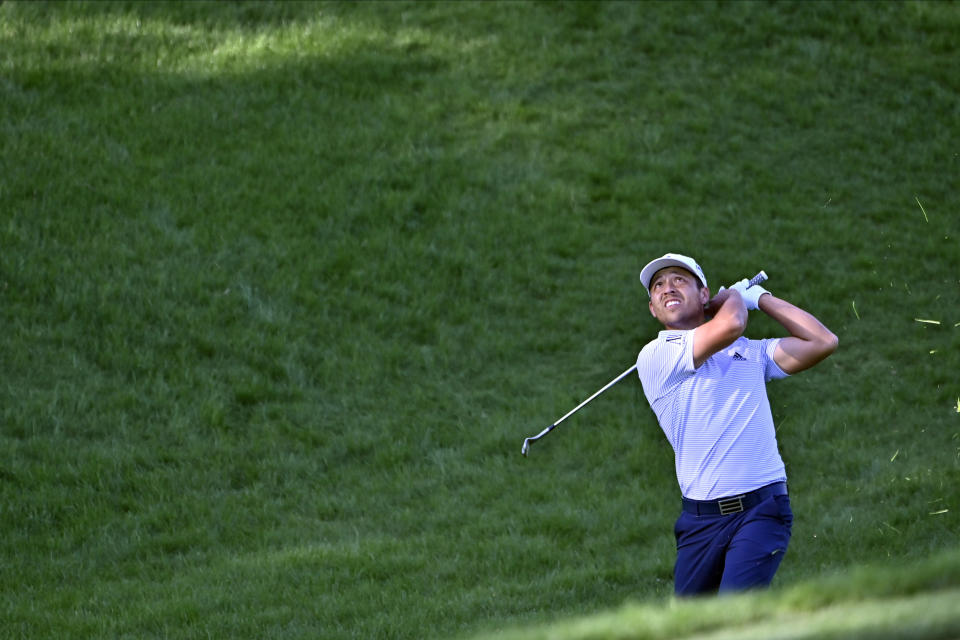 Xander Schauffele makes a fairway shot during the final round of the CJ Cup golf tournament at Shadow Creek Golf Course, Sunday, Oct. 18, 2020, in North Las Vegas. (AP Photo/David Becker)