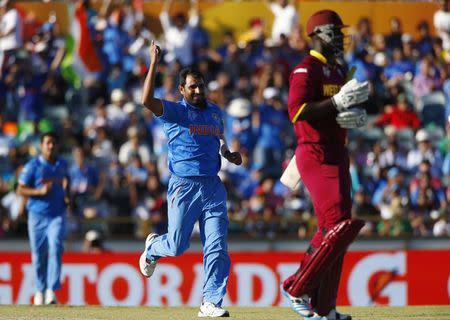 India's bowler Mohammed Shami celebrates the dismissal of West Indies batsman Darren Sammy during their Cricket World Cup match in Perth, March 6, 2015. REUTERS/David Gray