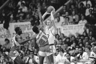 FILE - Larry Bird of the Boston Celtics, right, is defended by Wes Matthews, of the Atlanta Hawks, left, in second half NBA playoff action at Boston Garden, April 20, 1983. Bird led all scorers in the game with 26 points as Boston defeated Atlanta 103-96 to take a 1-0 lead in the best-of-seven series. (AP Photo/Mike Kullen, File)