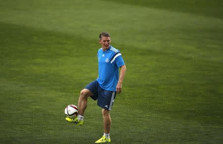 Germany's national soccer player Bastian Schweinsteiger controls the ball during a training session at Algarve stadium in Faro, Portugal June 12, 2015. REUTERS/Rafael Marchante