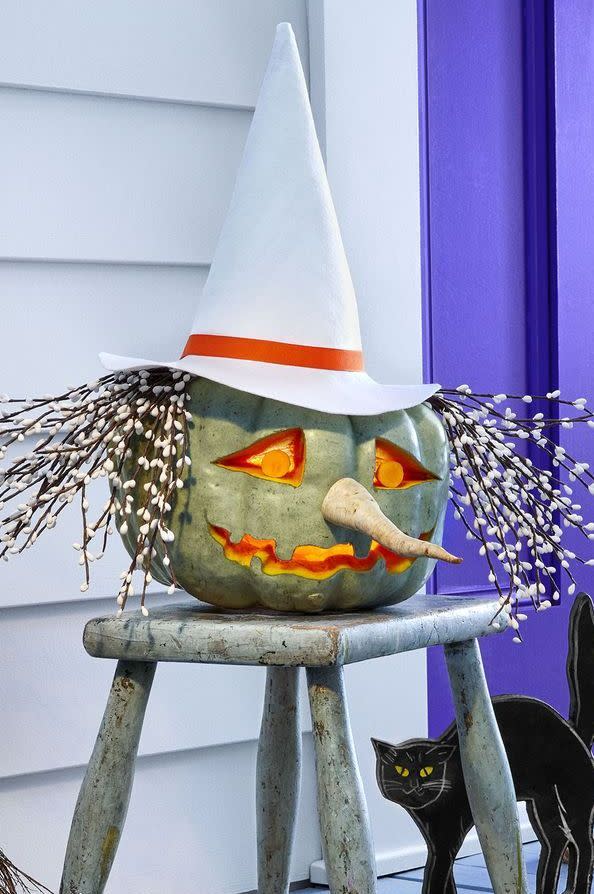 <p>If you can't get your hands on a green heirloom pumpkin, paint a regular orange one in a muted green hue for a similar look. Then dress it up with parsnip nose, hair made out of a twigs, and witch's hat. Now, it's up for you to decide: Is it more of a Glinda or Elphaba?</p>