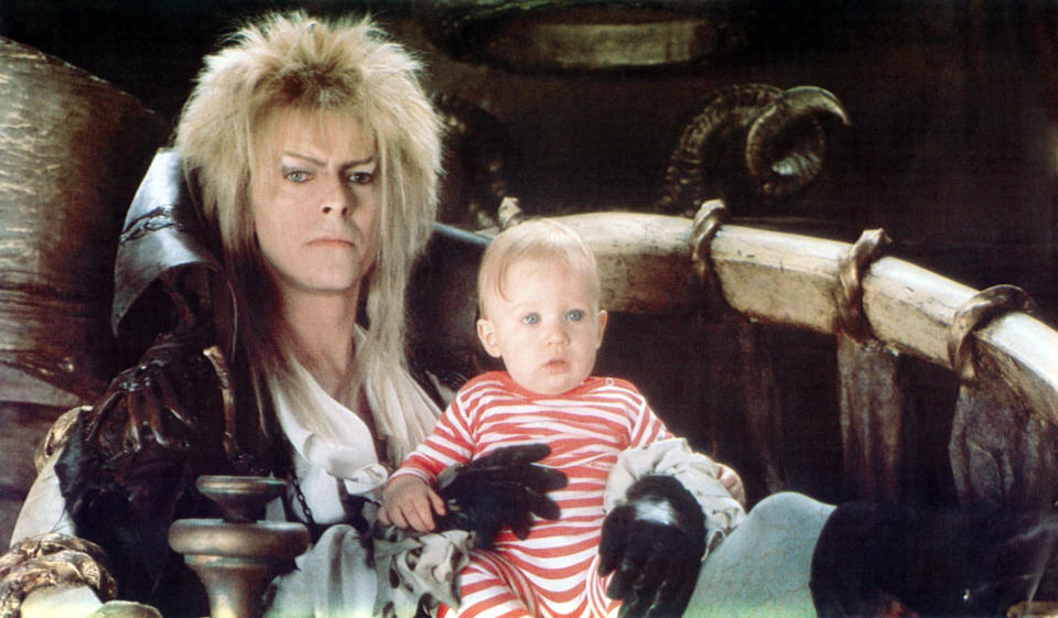 goblin king holding a baby