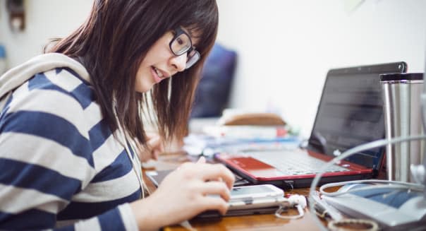 Young girl studing in dormitory