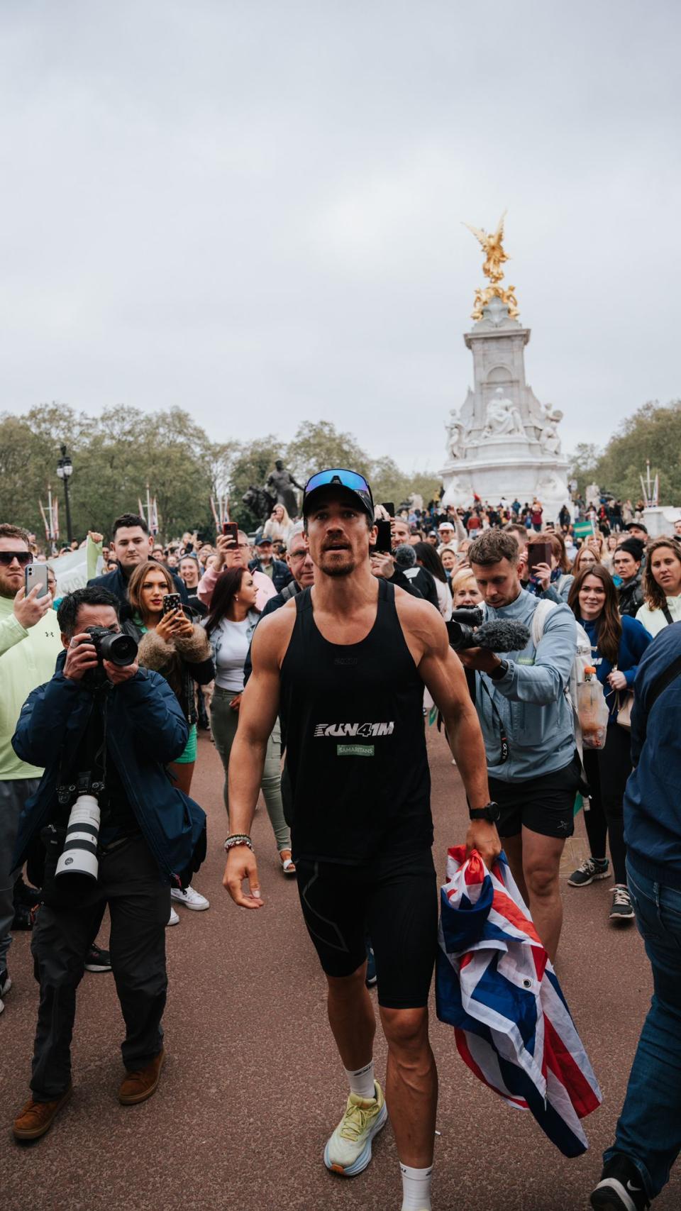 Joshua Patterson in London, after completing his 76th marathon last year. (Supplied)