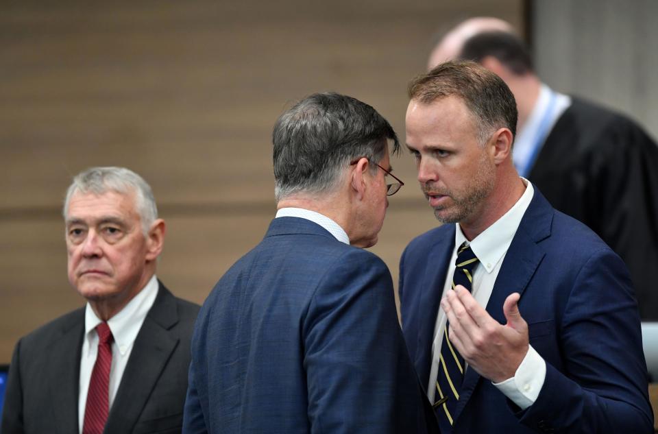 Kowalski family attorneys Nick Whitney, far right, and Greg Anderson, center, confer following a sidebar during proceedings at the South County Courthouse in Venice, FL on Thursday, Oct. 26, 2023. On the left is C. Howard Hunter, attorney for John Hopkins All Children's Hospital. The Kowalski family is suing Johns Hopkins All Children's Hospital for false imprisonment, negligent infliction of emotional distress, medical negligence, battery, and other claims more than a year after the family matriarch, Beata Kowalski, took her life following allegations she was abusing her daughter, Maya Kowalski. Pool photo/Mike Lang/Sarasota Herald-Tribune