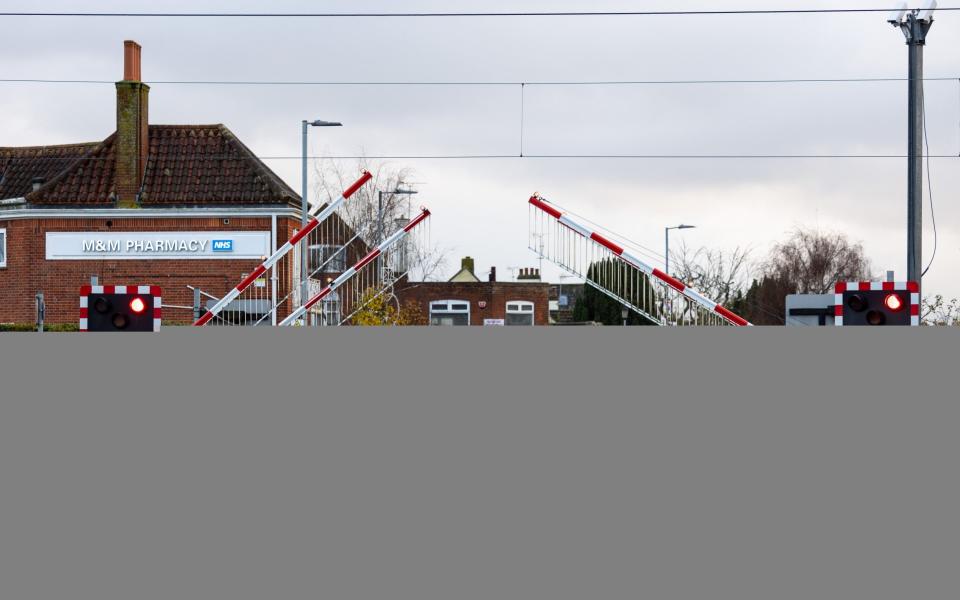 Locals were up in arms when  the council replaced the man who opened these level crossing gates with automatic barriers