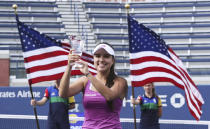 Maria Camila Osorio Serrano, of Colombia, holds up the trophy after defeating Alexandra Yepinfanova during the junior girls singles final of the U.S. Open tennis championships Sunday, Sept. 8, 2019, in New York. (AP Photo/Charles Krupa)