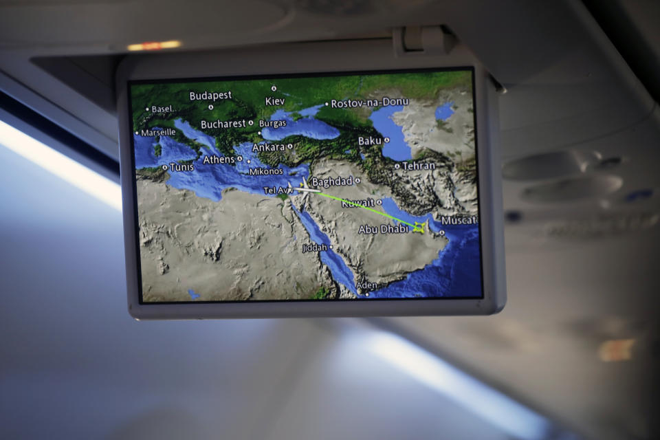 An overhead screen displays a map showing the flight route of an El Al plane from Israel en route to Abu Dhabi, United Arab Emirates, Monday, Aug. 31, 2020. The El Al plane carrying a high-ranking American and Israeli delegation to Abu Dhabi completed the first-ever direct commercial passenger flight to the UAE. The Israeli flag carrier’s flight Monday marks the implementation of the historic U.S.-brokered deal to normalize relations between the Israel and the UAE. (Nir Elias/Pool Photo via AP)