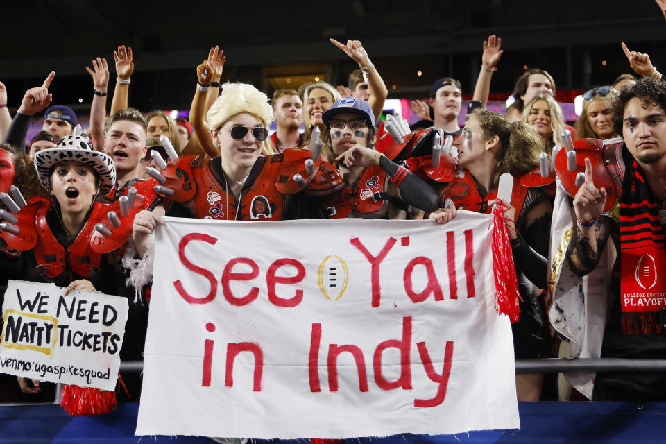 MIAMI GARDENS, FLORIDA - DECEMBER 31: Georgia Bulldogs fans hold a sign in the second half of a game against the Michigan Wolverines in the Capital One Orange Bowl for the College Football Playoff semifinal game at Hard Rock Stadium on December 31, 2021 in Miami Gardens, Florida. (Photo by Michael Reaves/Getty Images)