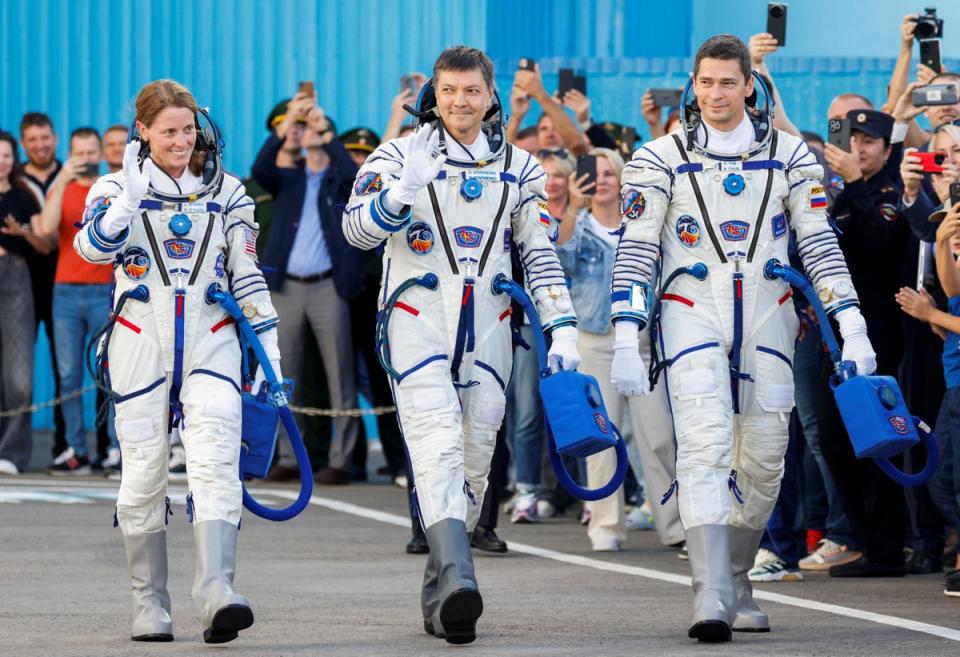 Nasa astronaut Loral O'Hara with Roscosmos cosmonauts Oleg Kononenko and Nikolai Chub before the departure to the launchpad at the Baikonur Cosmodrome, Kazakhstan, on September 15, 2023 (Reuters)