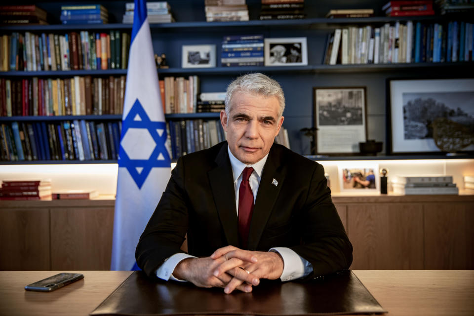 Israel's opposition leader Yair Lapid poses for a photo at his office in Tel Aviv, Israel, Thursday, May 21, 2020. (AP Photo/Oded Balilty)