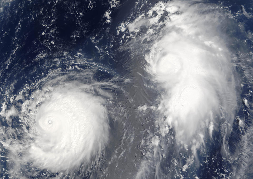 Typhon Mawar (left) and Tropical Cyclone Guchol (right) on 22 August 2005, far out in the northwestern Pacific Ocean, some 900 kilometers from Tokyo. True-colour satellite image using MODIS data., Typhoon Mawar And Tropical Cyclone Guchol, Western Pacific, In 2005, True Colour Satellite Image (Photo by Planet Observer/Universal Images Group via Getty Images)