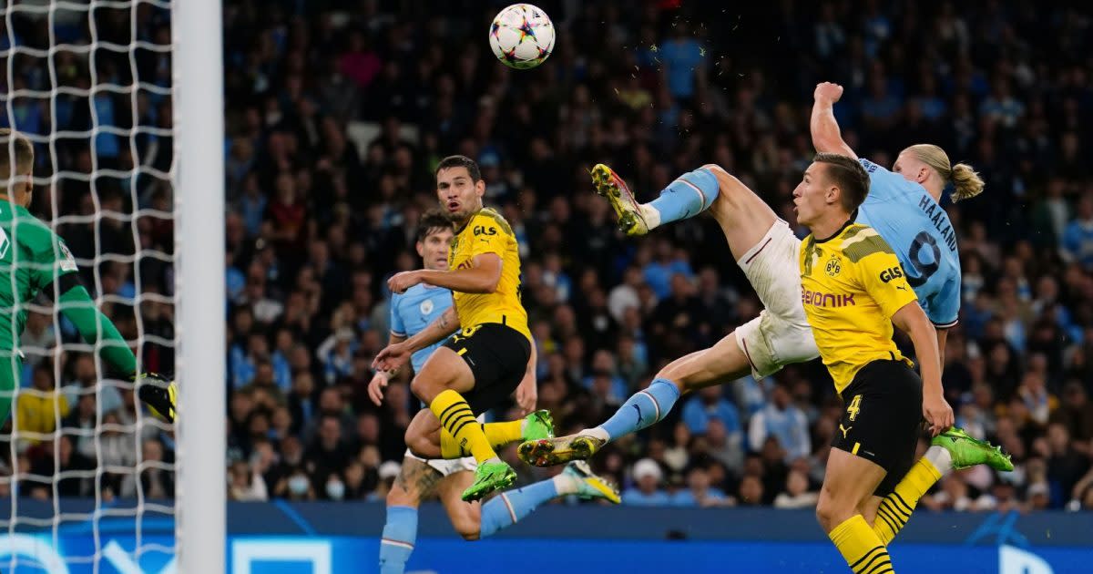 Man City striker Erling Haaland scoring a goal Credit: PA Images