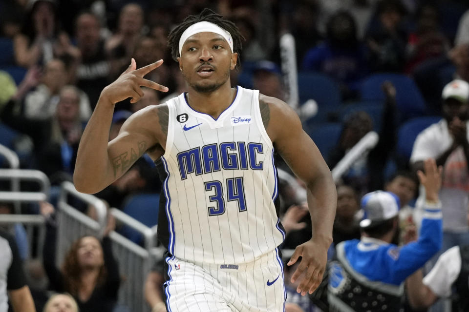 Orlando Magic's Wendell Carter Jr. (34) holds out three fingers after sinking a 3-point shot against the Washington Wizards during the second half of an NBA basketball game, Tuesday, March 21, 2023, in Orlando, Fla. (AP Photo/John Raoux)