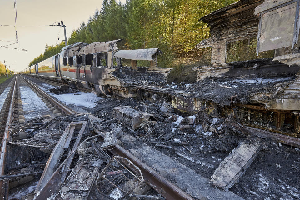 Remnants of a train lay on the tracks after an ICE high-speed train caught fire in Dierdorf near Montabaur, western Germany, Friday, Oct. 12, 2018. Nobody was injured in the fire that broke out for unknown reasons. (Thomas Frey/dpa via AP)