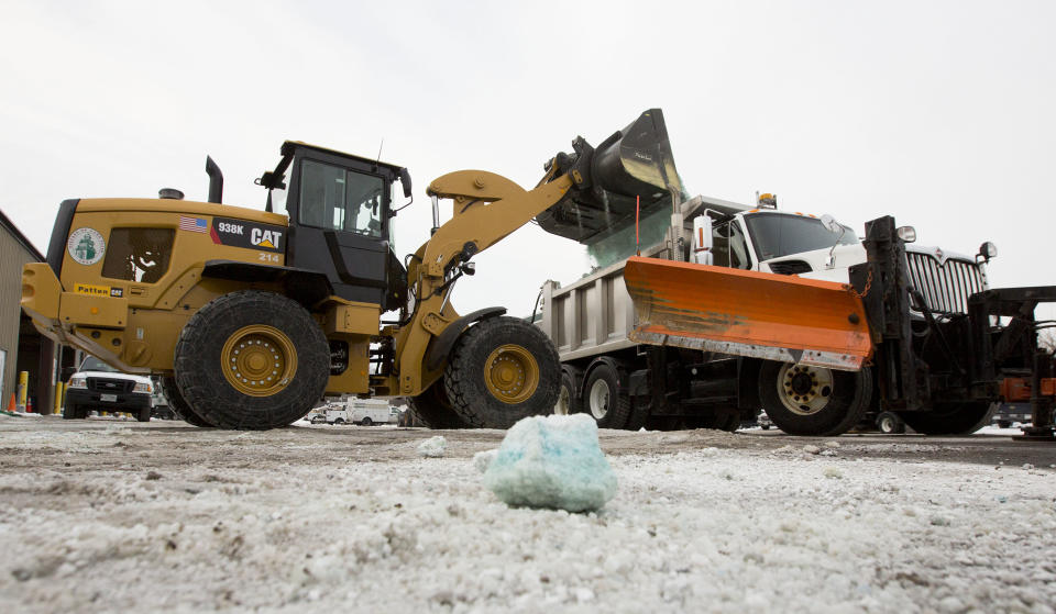 Road salt is loaded into a snow plow truck equipped with a salt spreader at the public works facility in Glen Ellyn, Ill., on Tuesday, Feb. 4, 2014. The Midwest's recent severe winter weather has caused communities to expend large amounts of their road salt supplies. (AP Photo/Andrew A. Nelles)