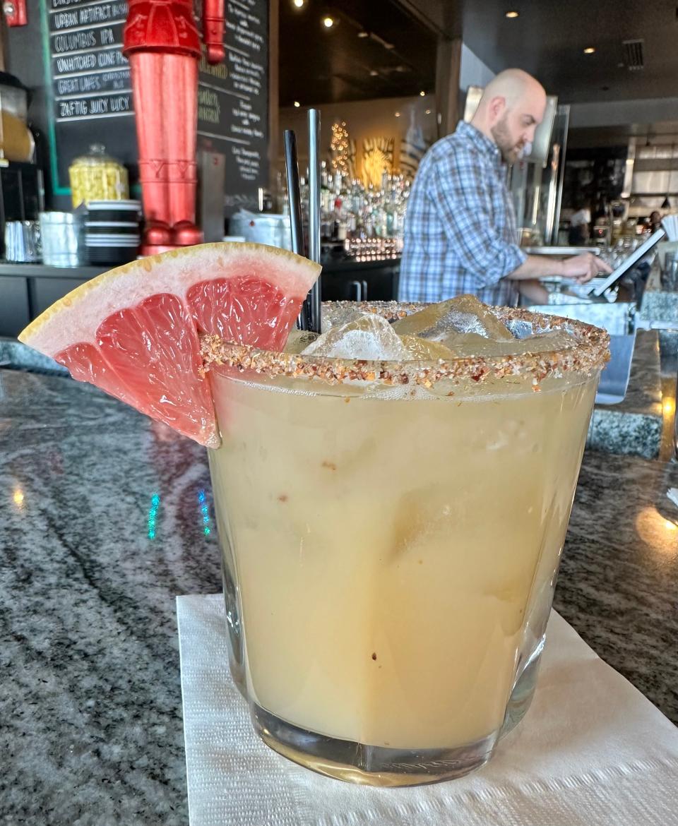 Daniel, a bartender at Table Six in Jackson Township, waits on a customer after creating the non-alcoholic drink No-Loma.