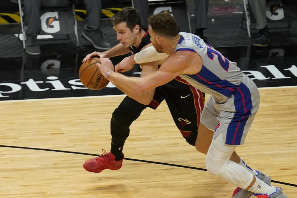 Detroit Pistons forward Blake Griffin (23) defends Miami Heat guard Goran Dragic (7) during the second half of an NBA basketball game, Monday, Jan. 18, 2021, in Miami. (AP Photo/Marta Lavandier)