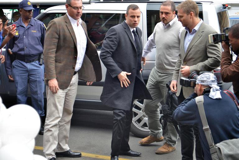 South African Paralympic track star Oscar Pistorius arrives at Court in Pretoria on April 14, 2014