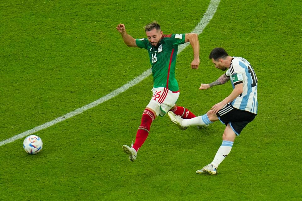 Argentina's Lionel Messi scores his side's first goal during the World Cup group C football match between Argentina and Mexico, at the Lusail Stadium in Lusail, Qatar, Saturday, Nov. 26, 2022. (AP Photo/Julio Cortez)