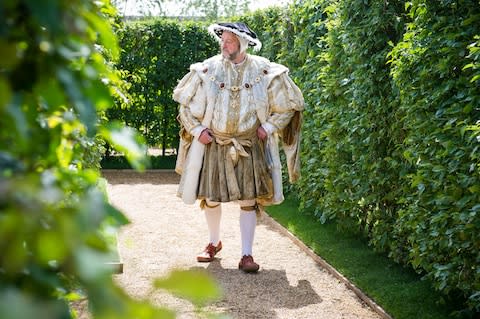 Henry VIII did not wander the maze at Hampton Court. But men in costume sometimes do - Credit: JOHN NGUYEN/JNVISUALS