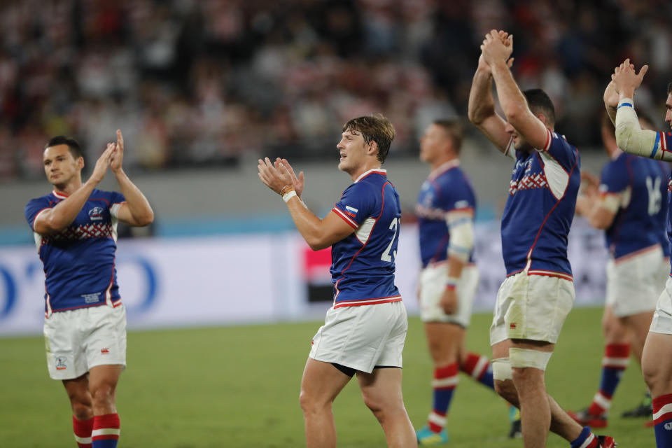 Russian players acknowledge the crowd after the Rugby World Cup Pool A game at Tokyo Stadium between Russia and Japan in Tokyo, Japan, Friday, Sept. 20, 2019. Japan won the match 30-10. (AP Photo/Christophe Ena)