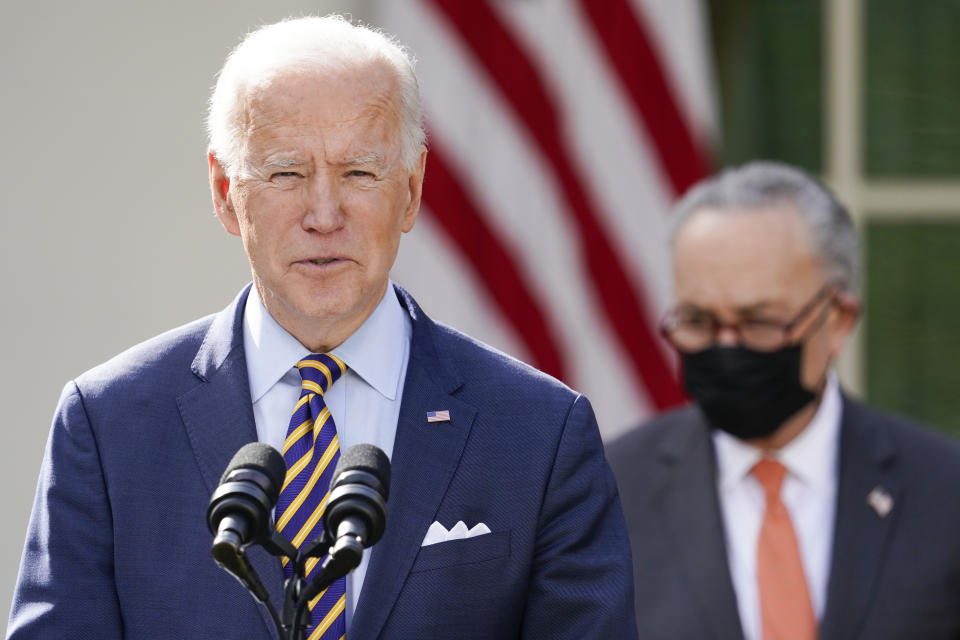 President Joe Biden speaks about the American Rescue Plan, a coronavirus relief package, in the Rose Garden of the White House, Friday, March 12, 2021, in Washington. Senate Majority Leader Chuck Schumer of N.Y., is at right. (AP Photo/Alex Brandon)