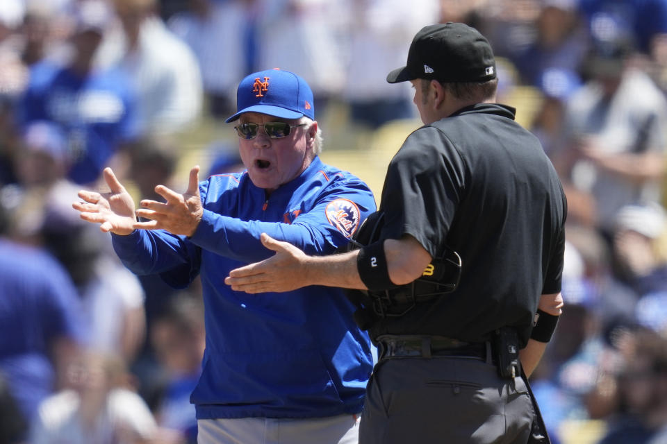 New York Mets Manager Buck Showalter, left, reacts with umpire Dan Bellino after starting pitcher Max Scherzer was ejected from the game for a problem with his glove during the fourth inning of a baseball game in Los Angeles, Wednesday, April 19, 2023. Scherzer was ejected from the game. Manager Buck Showalter, left, disputes the call with umpire Dan Bellino. (AP Photo/Ashley Landis)