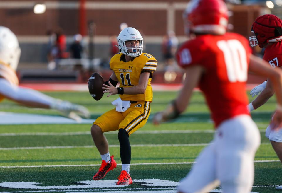Kickapoo quarterback Chase Hamme looks for an open receiver during a jamboree game with the Ozark Tigers and Nixa Eagles at Ozark on Friday, Aug. 18, 2023.