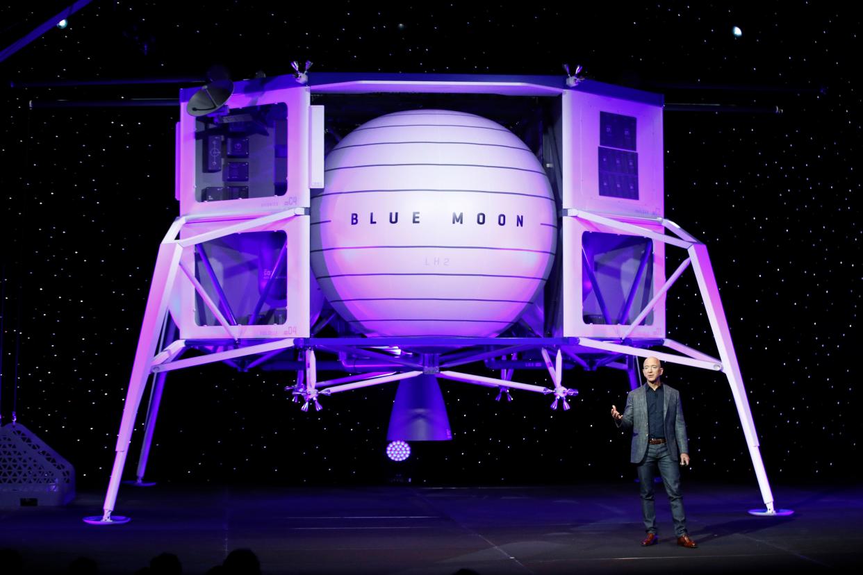 In this, May 9, 2019 photo, Jeff Bezos speaks in front of a model of Blue Origin's Blue Moon lunar lander in Washington.