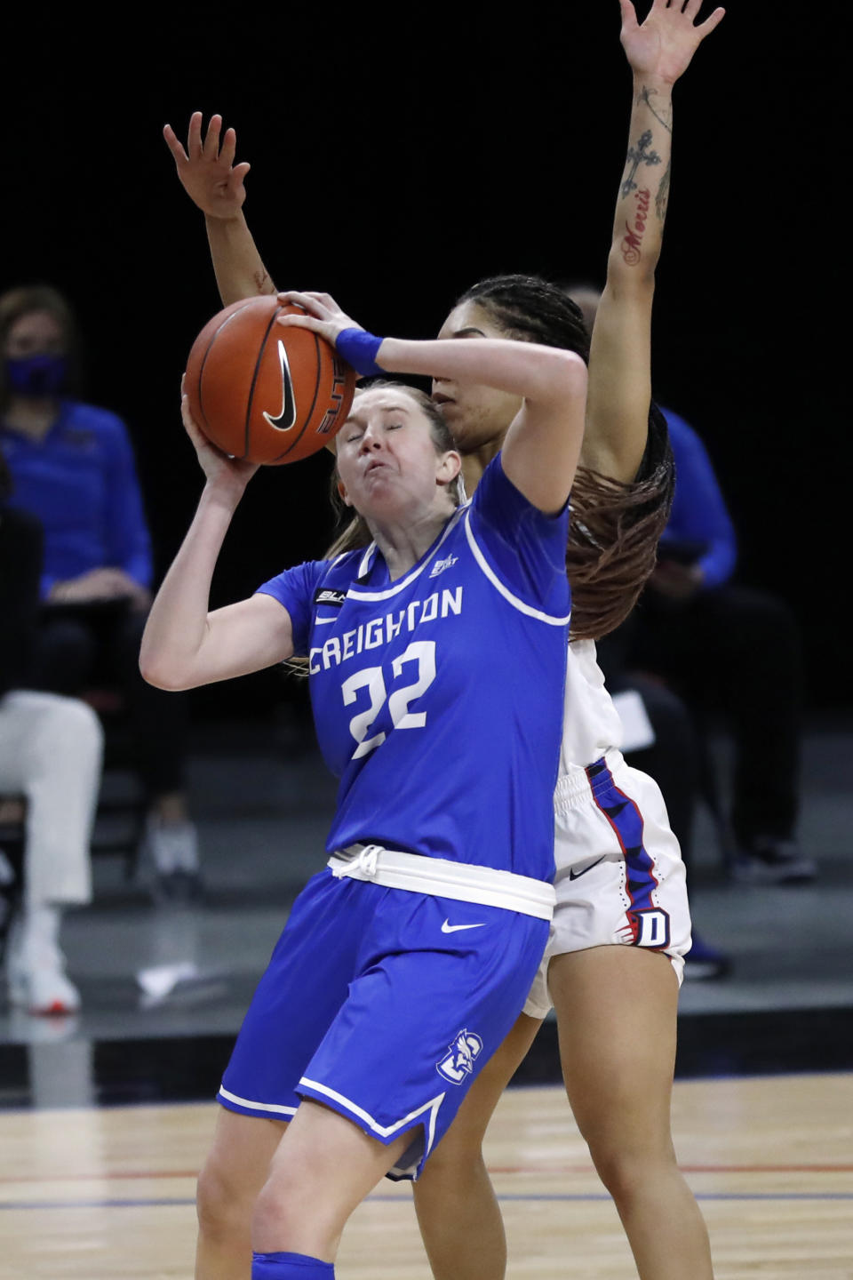 Creighton guard Carly Bachelor (22) is pressured by DePaul guard Sonya Morris during the first half of an NCAA college basketball game Saturday, Feb. 20, 2021, in Chicago. (AP Photo/Shafkat Anowar)