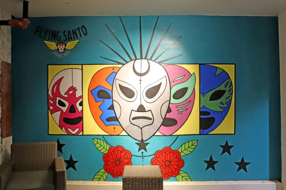 A mural outside of Flying Santo taco bar in the Jones421 building in downtown Sioux Falls is almost completed as of May 20. The artist, Jillian Artistry, will continue to add jewels to the famous silver mask worn by Mexican wrestler El Santo. The restaurant should open sometime in June.