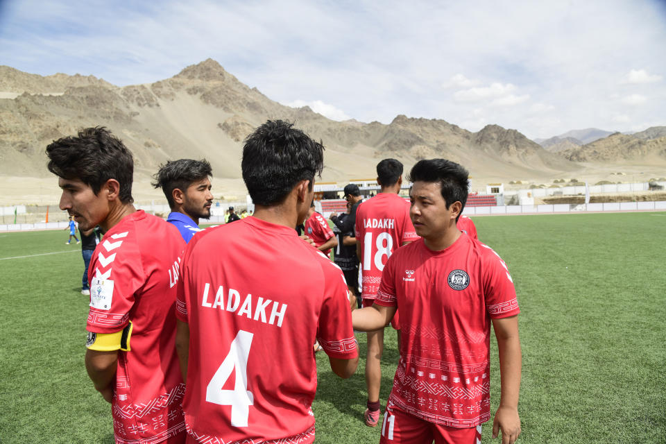 Players interact during “climate cup” a first of its kind “climate-friendly” soccer tournament on the outskirts of Leh, Ladakh, India, Tuesday, Sept.5, 2023. The organizers say the matches are first in Asia to be held at an altitude of 11,000 feet, about 3,350 meters, and with a minimum carbon footprint. Ladakh is an ecologically fragile territory where oxygen is thin, and breathing is hard. (AP Photo/Stanzin Khakyab)