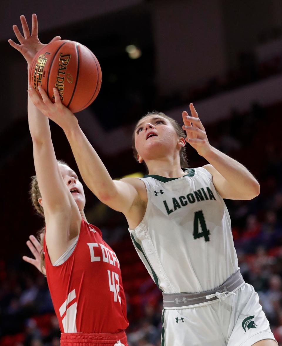 Laconia's Molly Duel (4) puts up a shot against Colfax's McKenna Shipman during their WIAA Division 4 girls basketball state semifinal game Thursday at the Resch Center in Ashwaubenon.