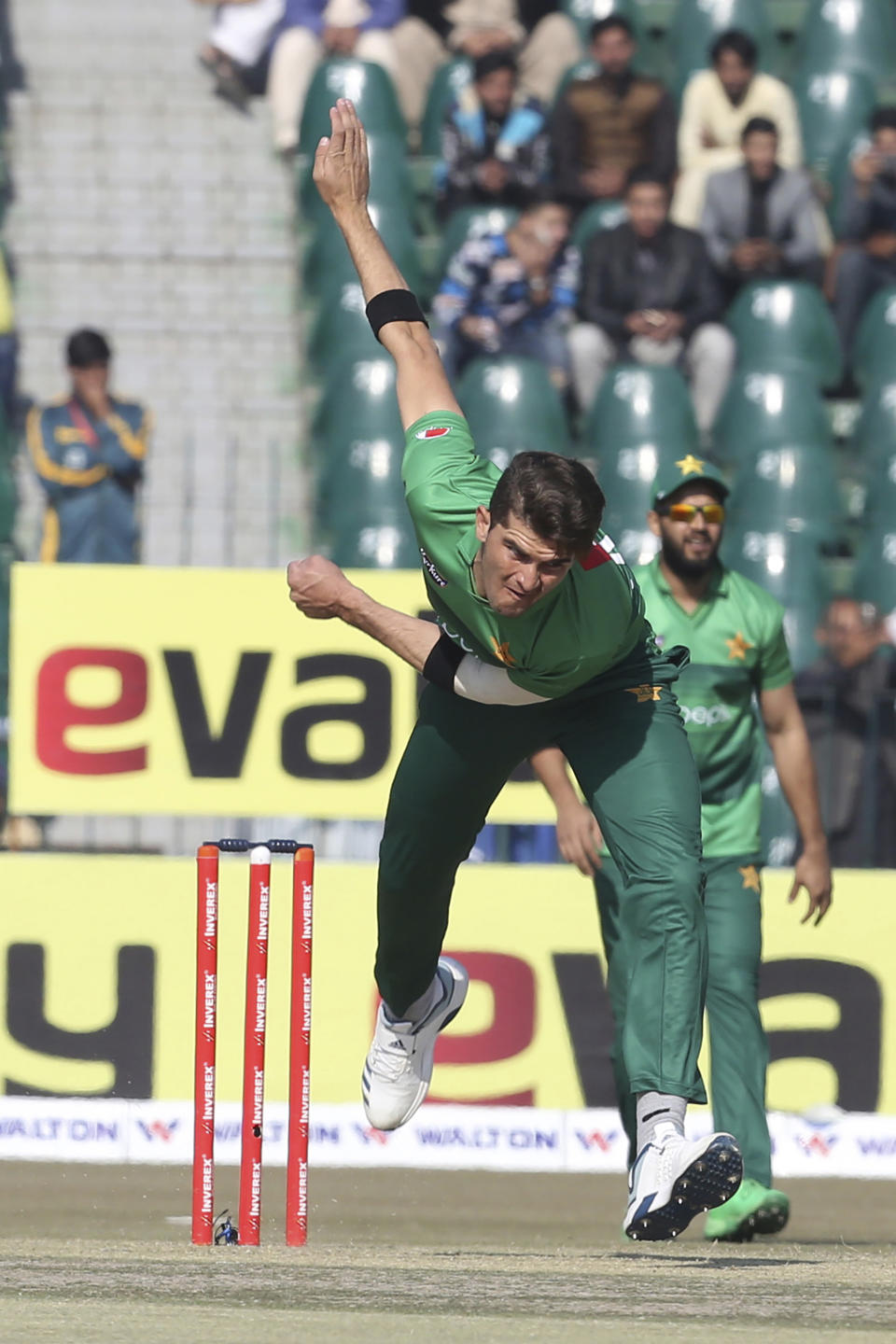 Pakistani bowler Shaheen Afridi bowls against Bangladesh at the Gaddafi Stadium in Lahore, Pakistan, Friday, Jan. 24, 2020. Pakistan and Bangladesh are playing their first T20 of the three matches series under tight security. (AP Photo/K.M. Chaudary)