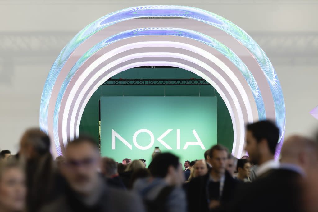 a big NOKIA logo and a blurry crowd of people in front of it