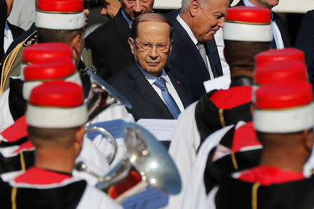 Lebanese President Michel Aoun reviews Tunisian musicians upon his arrival at the Tunis-Carthage International Airport to attend the Arab Summit, in Tunis, Tunisia March 30, 2019. Hussein Malla/Pool via REUTERS