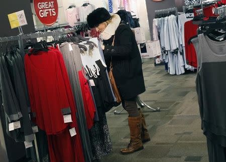 A woman shops for jeans at a J.C. Penney store in New York November 27, 2012. REUTERS/Shannon Stapleton