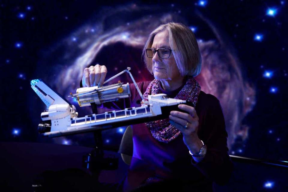 Former NASA astronaut Dr. Kathy Sullivan plays with LEGO's Discovery Space Shuttle Set